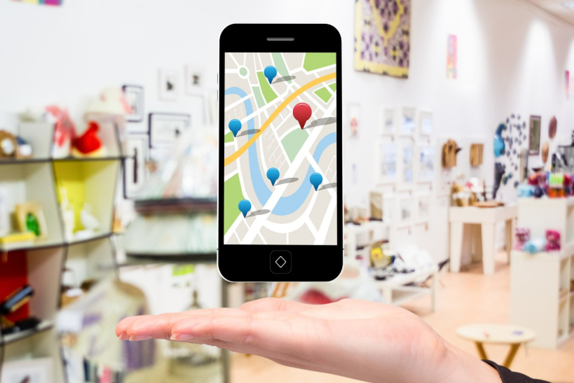 Smartphone map with nearby location pins ready for selection, illustrating near me search intent.