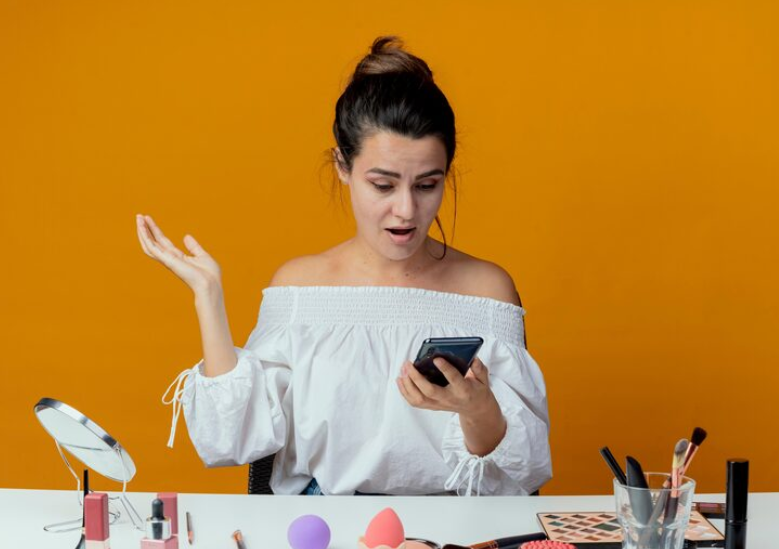 Person reacts to a product on their phone, illustrating what people search after a product goes viral.