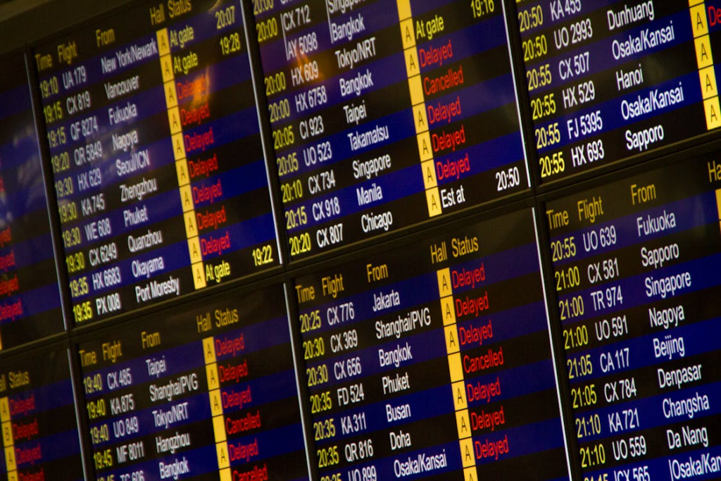 Plan change search behavior triggered by flight delays on an airport departure board.