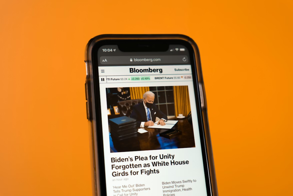 Headline trust search behavior triggered by a breaking political story on a smartphone screen.
